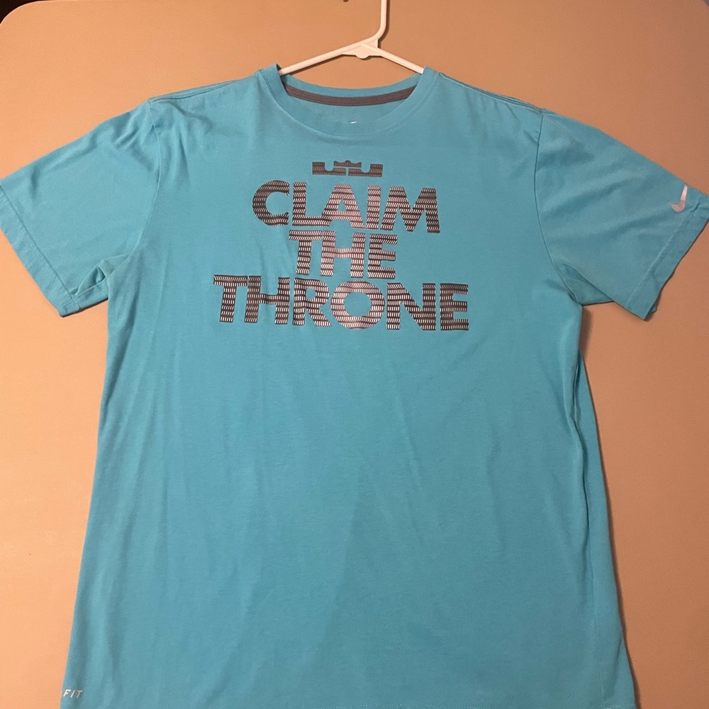 Light blue Nike LeBron James “claim the throne” graphic, dri-fit t-shirt